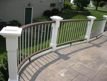 Curved railing with stamped co