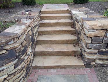 moore job this is outside stairs, seating area, sunk in play area with fire pit. intertaining area