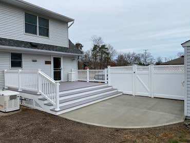 Back Yard Remodel VEKA decking, vinyl railings, concrete patio.