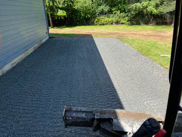 Concrete Hardscaping Project Upgraded and added new concrete around the homeowner's home and shop. Also created a gravel pad for RV parking and built a