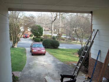 Enclosed garage port
