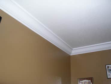 Crown molding, painting, and flooring Installed crown molding in guest room. Installed laminate flooring in guest room. Painted the guest room.