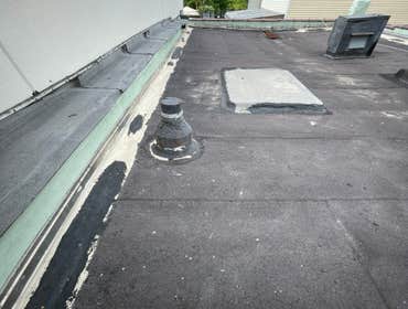 Before: Existing flat roof in deteriorated condition