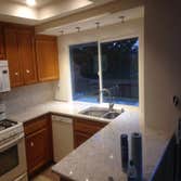 New window and counter tops with new canned lights Small Kitchen Remodel New window and counter tops as well as out side matching Bar