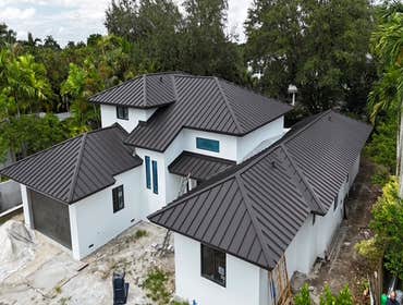 Photos by Gold Star Miami Corp #1 metal roof panels all are . 25 years warrantee