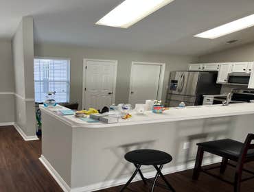Photos by Tropical Building & Remodeling Inc #1 Completely removed old kitchen and end pony wall. Cut down pony wall to cabinet height and installed ro