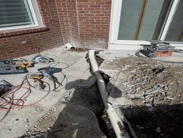Photos by Timber Rock Company Inc #6 Remove cove stone to run a pipe for gutters drainage