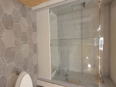 Photos by Trinity Remodeling LLC #3 Tub Relocation, Complete tile job, vanity and toilet