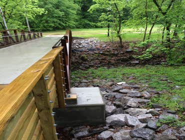 Photo(s) from RamJack Mississippi LLC Boardwalk helical piles with battered piles. Bridge abutment piles