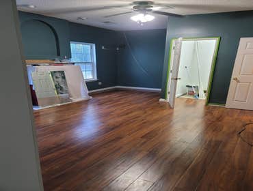 Converted livingroom into in-law bedroom and remodeled bathroom Converted livingroom into in-law bedroom (installed new laminate flooring, removed wall