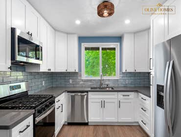Contemporary White Kitchen with Blue & Gray Accents in Sacramento, CA 95864 This kitchen remodel offers a refreshing blend of cool tones and textures. 