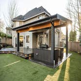 Redmond, Issaquah, Kirkland, Woodinville, Bellevue. Patio cover with natural. Stone and concrete paver Tongue in groove soffit with electric heaters. S
