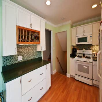 Des Plaines, IL 60018 This project included a kitchen remodel, addition remodel with new bow window, wainscoting and new siding