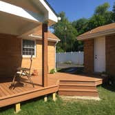 Covered back deck and side porch This beautiful backyard oasis includes a spacious deck which is partially covered by a 12 foot cathedral roof. This 