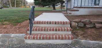 Concrete stoops with red brick