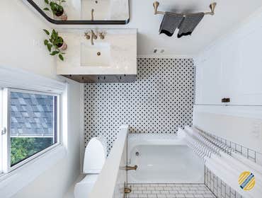 White Compact Bathroom We love how bright and spacious this bathroom appears now! The new color scheme opens the bathroom up and allows the beautiful n
