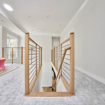Photos by San Clemente Woodworking #1 Stainless Steel horizontal rods with our custom shadow posts. Clean lines and modern design.