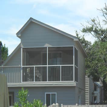 Custom Design Homes Project 1 Custom Design Homes added a screen porch overbuild. There was an open deck prior to this beautiful addition.