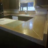 Custom poured in place monolithically poured backsplash and countertop Custom poured in place concrete countertop and backsplash.The backsplash and cou