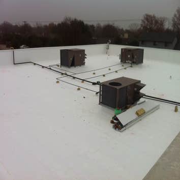 Roofing TPO Roofing with custom skylight.