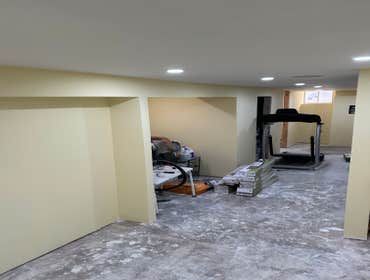 Photos by Your Expendable Services LLC #1 Basement remodeling project completed with new framework, walls placed and painted. New recess lights and LPV