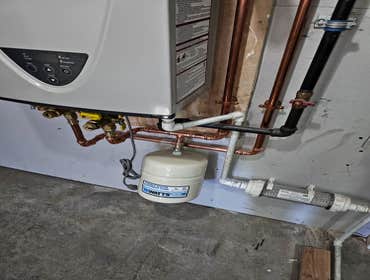 Photos by Pipe Wizard LLC #1 Neighbor had to have their faulty water heater replaced we installed the latest and best tankless water heater option and 
