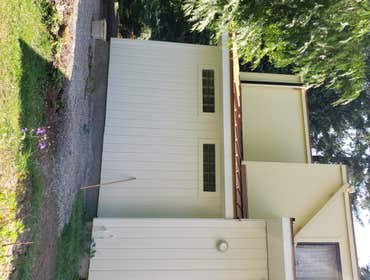 Home addition: New siding, window install, exterior and interior painting, metal roofing, new door, interior pine paneling.