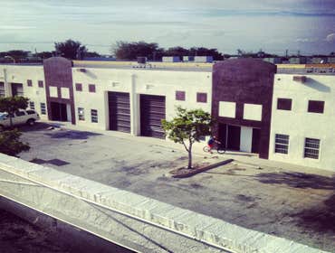 repainting warehouse in Hialeah Pressure washed, one coat of primer two coats of paint