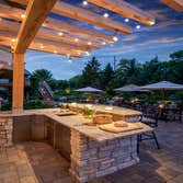 Outdoor Living by Mantis Design + Build, llc Paul Linnebach, owner of Mantis Design + Build, was asked to create a luxurious outdoor kitchen to servic