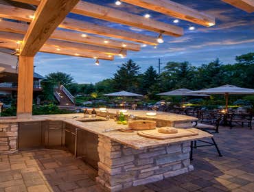 Outdoor Living by Mantis Design + Build, llc Paul Linnebach, owner of Mantis Design + Build, was asked to create a luxurious outdoor kitchen to servic