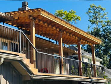 cedar patio cover with poly-plastic roof top.