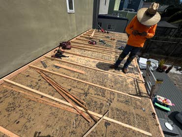 TPO 60 Mill with Framing Added pitch to low slope roof using 2x4s, new decking, radiant barrier thermal insulation, and 60 Mill TPO