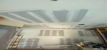Photos by Interior Art Drywall Inc #1 Hang the walls on ceiling and walls . I just let the open on ceiling where plumbers were pending to fix the pipes