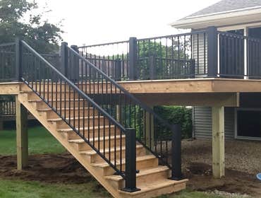 Photos by Custom Home Specialties Inc #2 Timber Tech maintenance free decks with powder coated railings.
