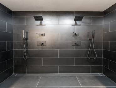 Full Bathroom Remodel High-quality tiles, sturdy countertops, stylish vanities, eco-friendly fixtures, modern shower systems, and luxury bathtub.