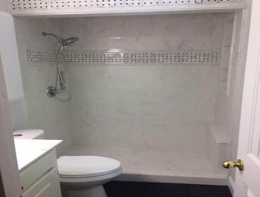 Photos by North Alabama Remodeling Co. LLC #2 Cultured marble showers with tile feature inlays in custom designed bathroom remodels