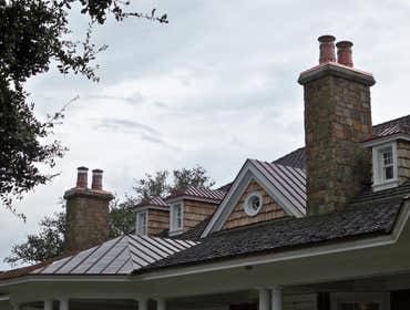 European Copper Pots on 5 chimneys. We designed, fabricated and installed custom copper flashing with 7 European Copper Pots for a luxury residence in 