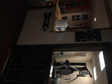 Finished basement... Man cave. This one of a kind project was all custom. Wood is rough cut pine. The customers chose a nice laminate to use on some of