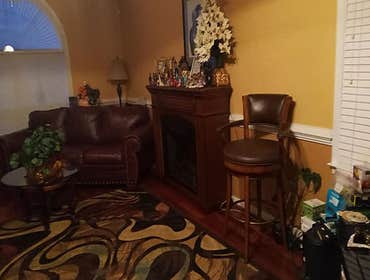 Photos by Alfreds Home Improvements #3 Room Addiiton with side porch, hardwood floors, and a fireplace.