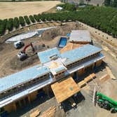 Photos by Aspire Homes Inc #3 Custom home with roof insulation, exterior insulation, solar, geothermal and pool.