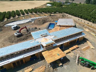 Photos by Aspire Homes Inc #3 Custom home with roof insulation, exterior insulation, solar, geothermal and pool.