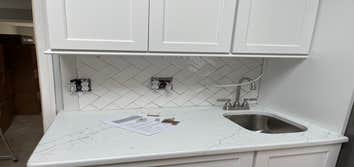 Photos by Smilenow Landscaping LLC #1 In this project, we installed custom backsplash as well as countertop installation.