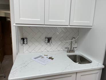 Photos by Smilenow Landscaping LLC #1 In this project, we installed custom backsplash as well as countertop installation.