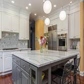 A Custom Island w/ Maple Cabinetry ?AMAZING? Features: A Custom Island with Maple Cabinetry painted Gauntlet Gray, plus brushed nickel hardware and Bri