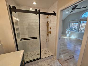 Photos by M&c Global Construction LLC #5 This Silver Spring, MD, renovation involved relocating the laundry room, remodeling the ensuite bathroom, inst
