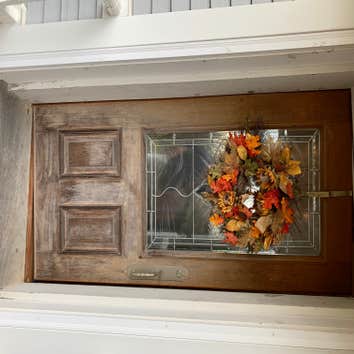Sun damaged mahogany front door