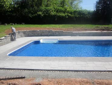 Photos by Dunn Landscape Construction #1 After initial pool installation provide all hardscape including retaining walls, pool deck, walkways and plant