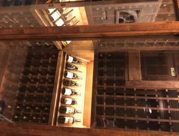 Wood st wine room Clear alder wood with dark walnut stain. Insulated glass with foam insulated walls, led lights, 560 bottle capacity