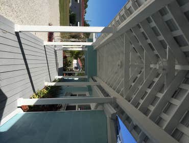 Breezeway to Garage w/ Exposed Metal Roof Framing Bayshore