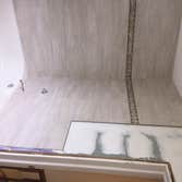 Photos by J. Roberts Installations #3 Here's a shower we tiled. we also tiled half way up the walls all the way around